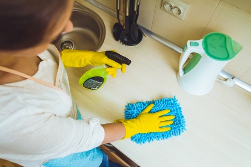 Local cleaning team preparing a kitchen and bathroom for move-in in Chiswick